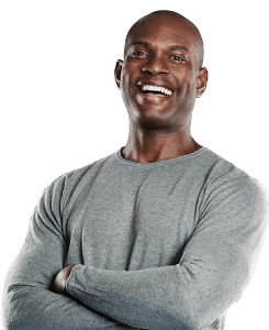 Black man laughing in grey shirt