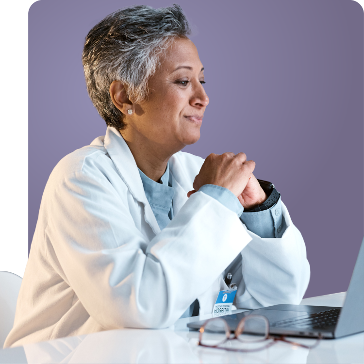 Compassionate healthcare provider in a white coat smiling during a virtual consultation, representing expert STI care and treatment with Q Care Plus.