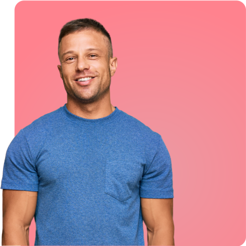 Easy At-Home STI Testing with Q Care Plus Smiling man in a blue t-shirt against a pink background, representing the simplicity and convenience of at-home STI testing with Q Care Plus.